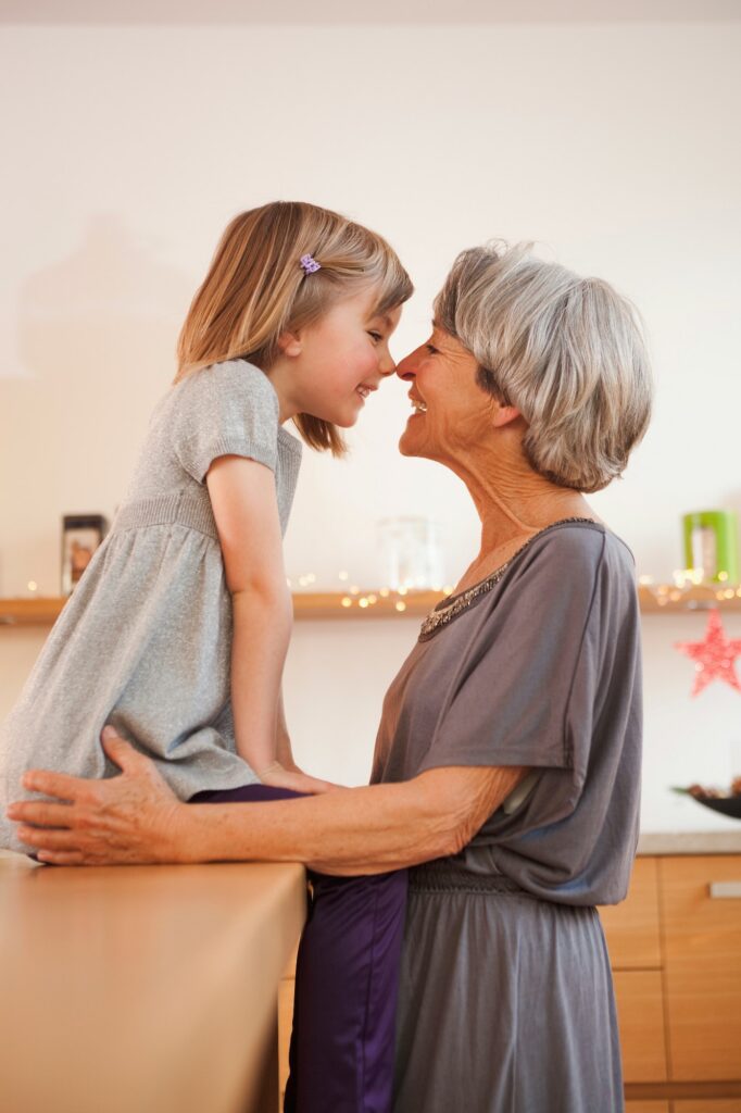 grandchild and grandma with candle