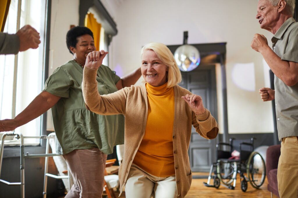 Happy Seniors Dancing in Retirement Home